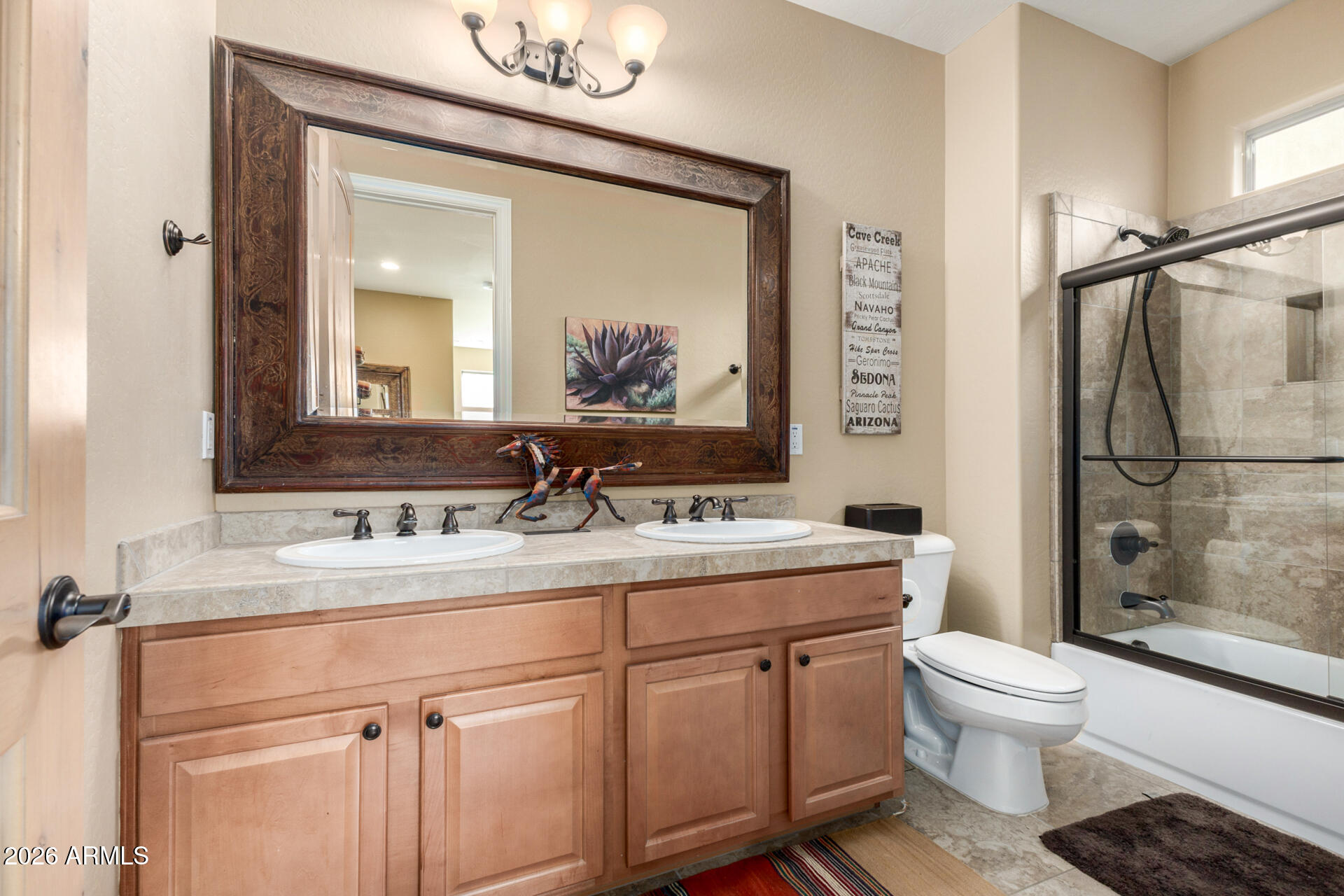 6434 East Military Road, Unit 102 Cave Creek, AZ 85331 - Photo 26 of 66 a bathroom with a sink a toilet and shower