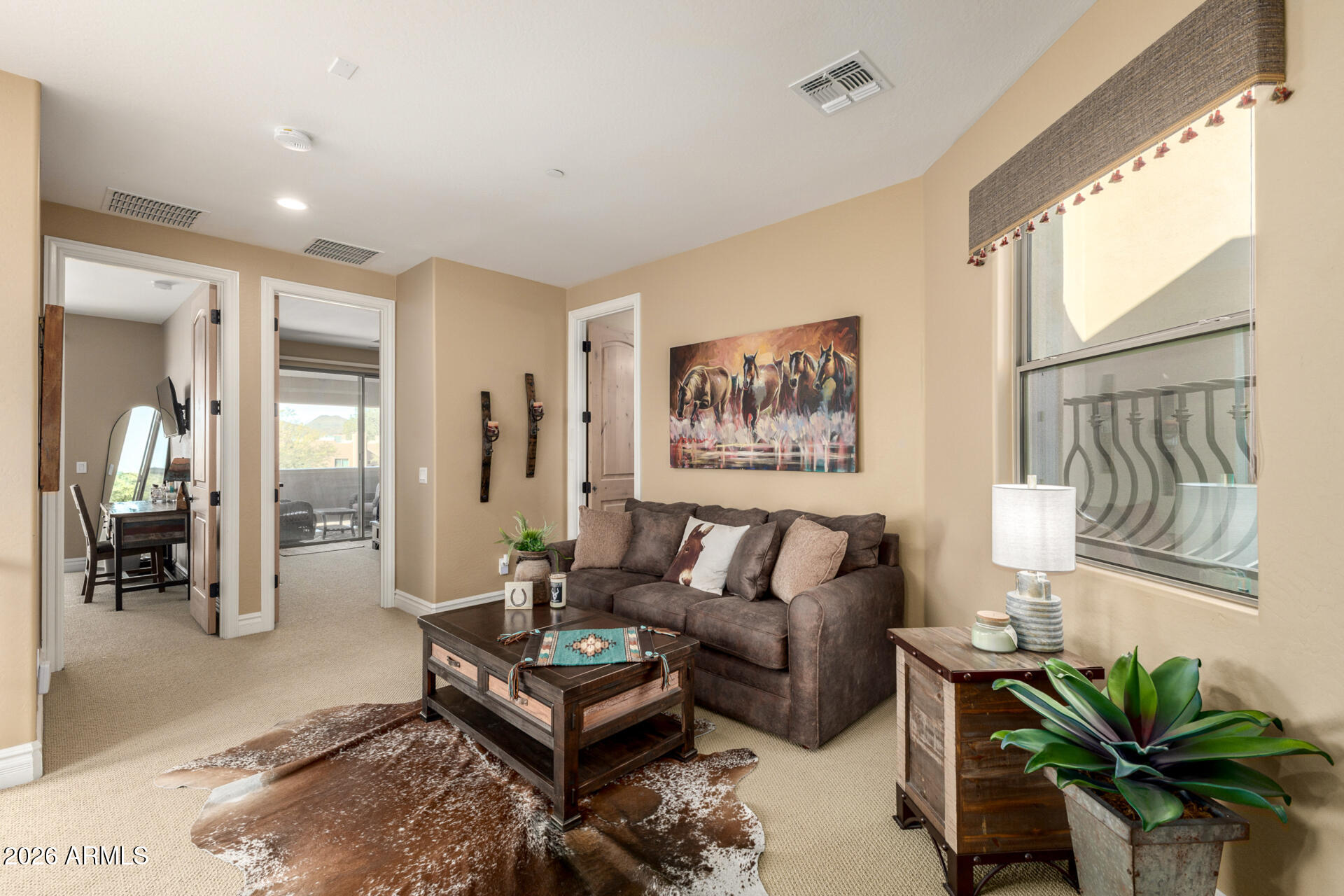 6434 East Military Road, Unit 102 Cave Creek, AZ 85331 - Photo 30 of 66 a living room with furniture a couch and a potted plant