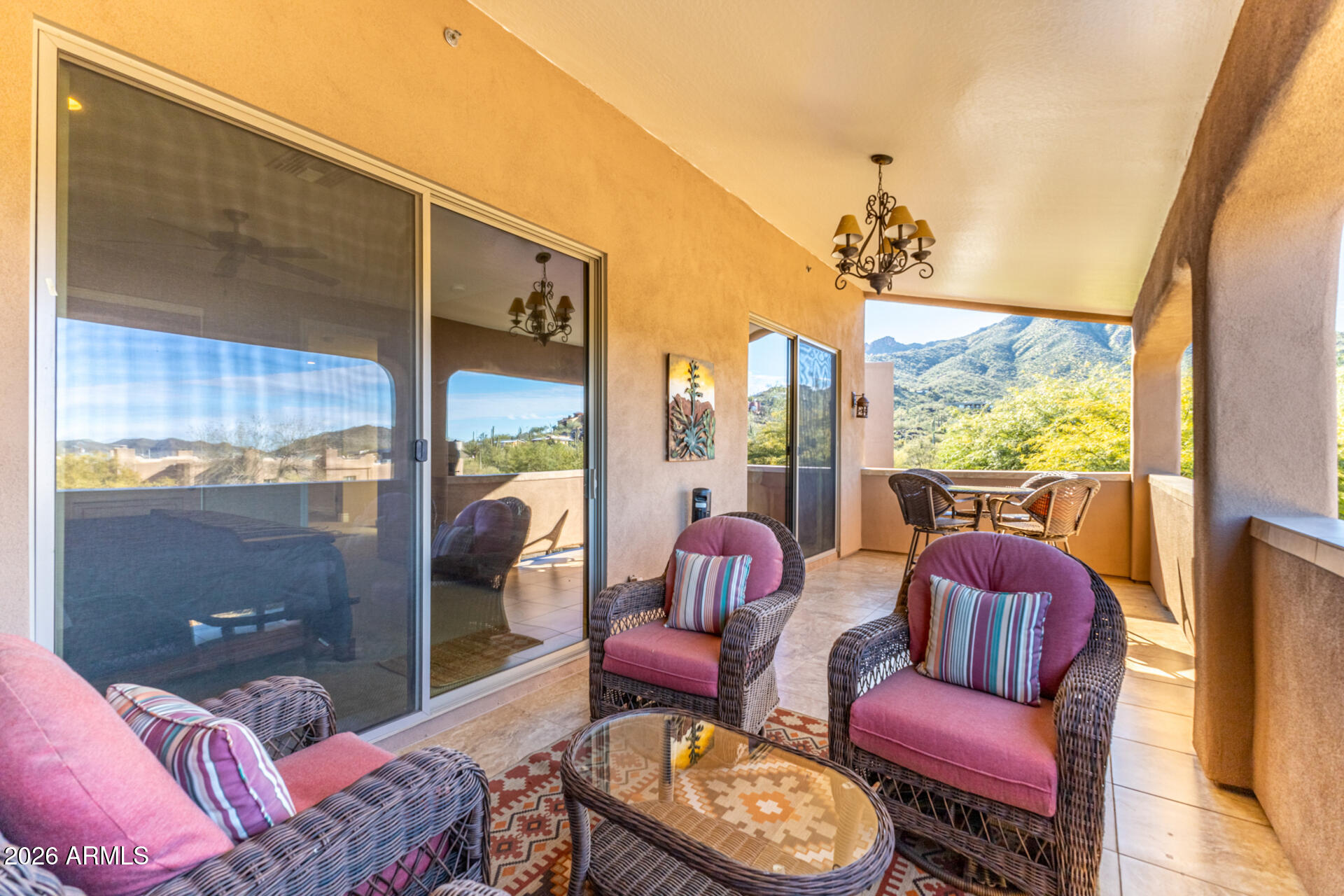 6434 East Military Road, Unit 102 Cave Creek, AZ 85331 - Photo 35 of 66 a living room with furniture and a floor to ceiling window
