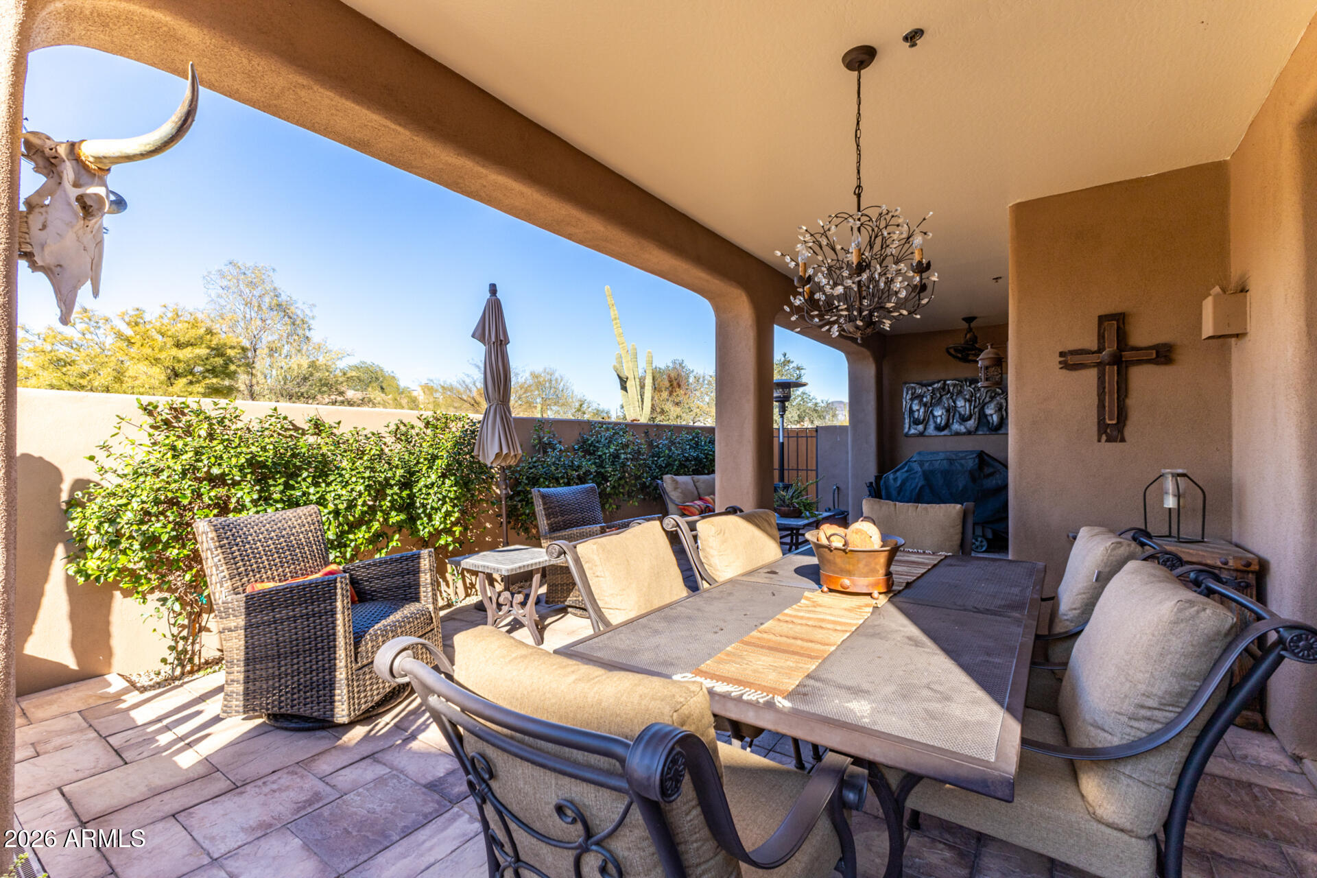6434 East Military Road, Unit 102 Cave Creek, AZ 85331 - Photo 39 of 66 a outdoor dining space with furniture and a potted plants