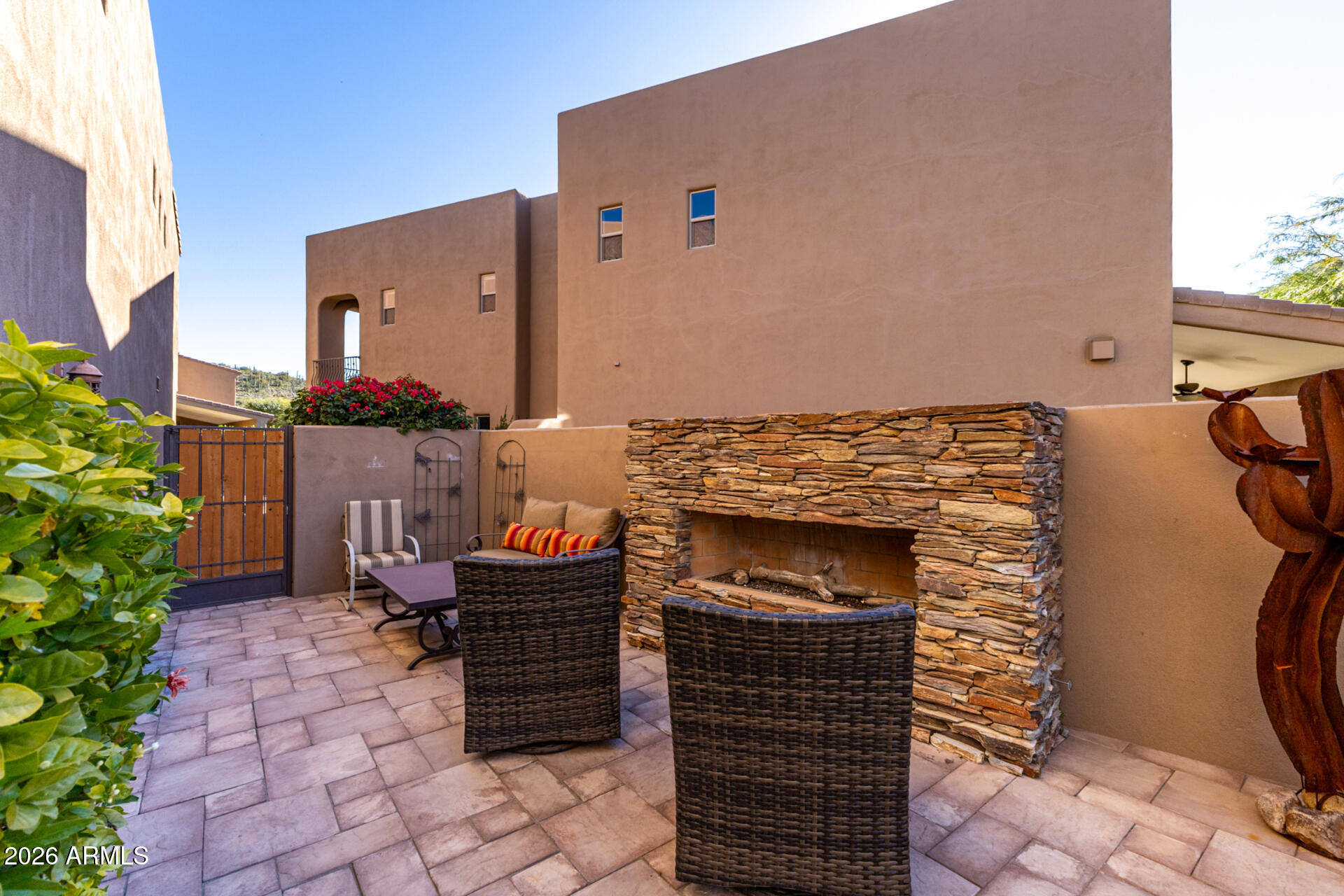 6434 East Military Road, Unit 102 Cave Creek, AZ 85331 - Photo 42 of 66 a backyard of a house with outdoor seating