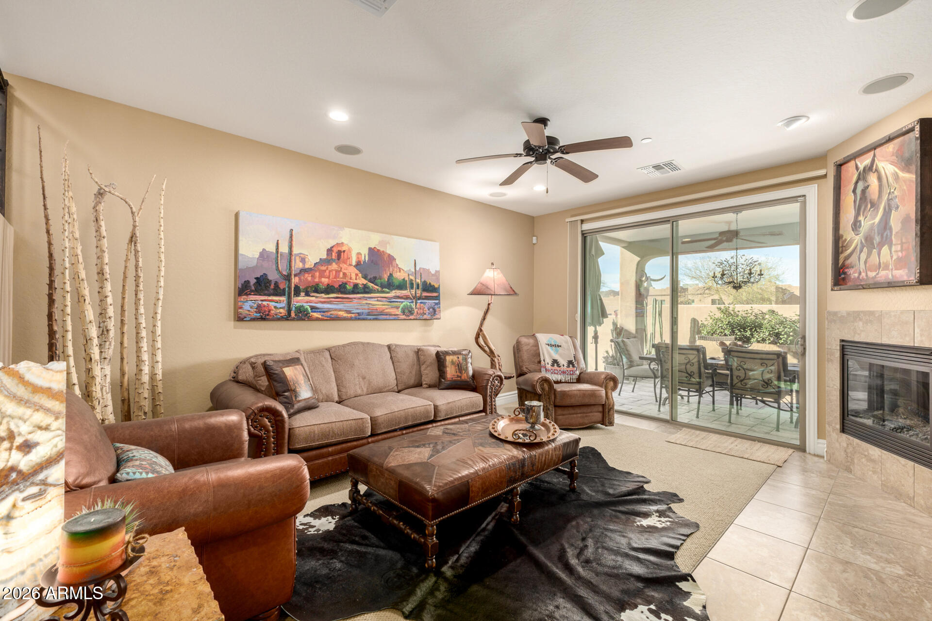 6434 East Military Road, Unit 102 Cave Creek, AZ 85331 - Photo 6 of 66 a living room with furniture a ceiling fan and a large window