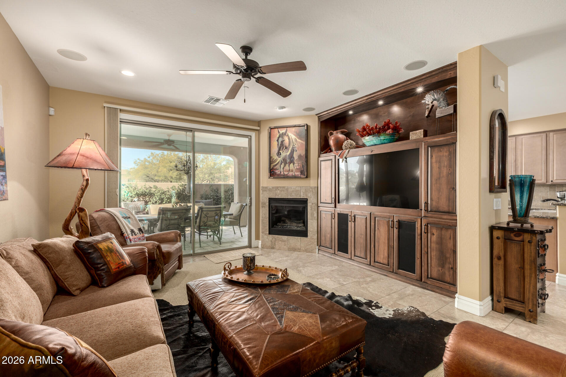 6434 East Military Road, Unit 102 Cave Creek, AZ 85331 - Photo 7 of 66 a living room with furniture a flat screen tv and a large window