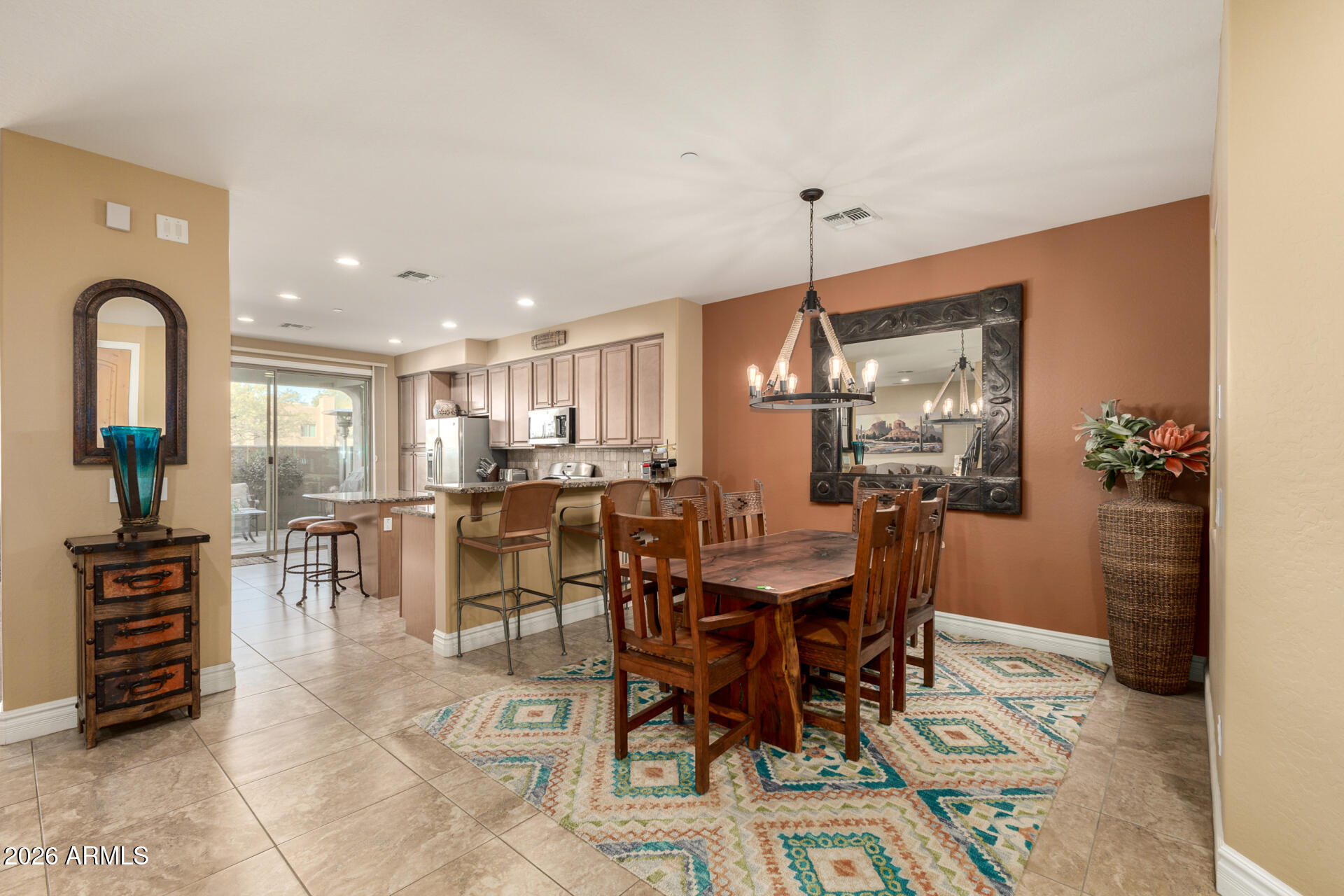 6434 East Military Road, Unit 102 Cave Creek, AZ 85331 - Photo 10 of 66 a dining room with furniture and wooden floor