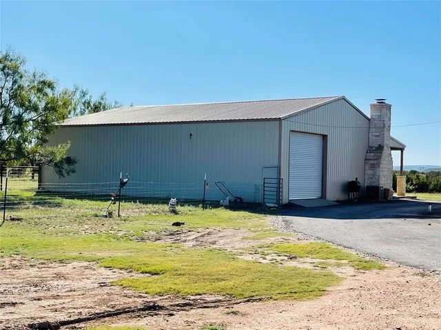 a kitchen that has a table and chairs in it