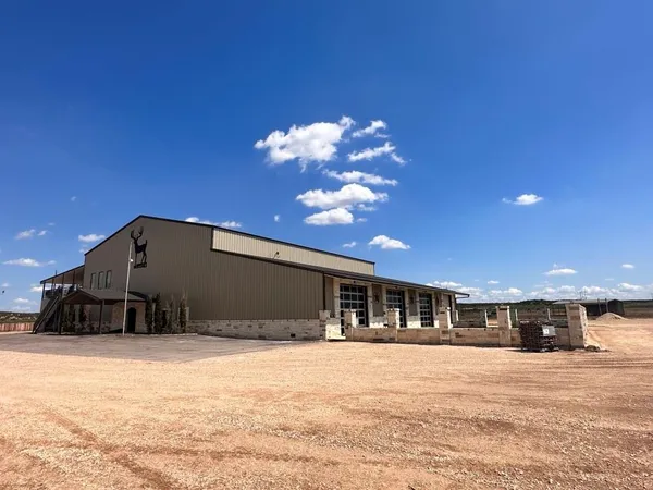 a view of entryway livingroom and hall with wooden floor