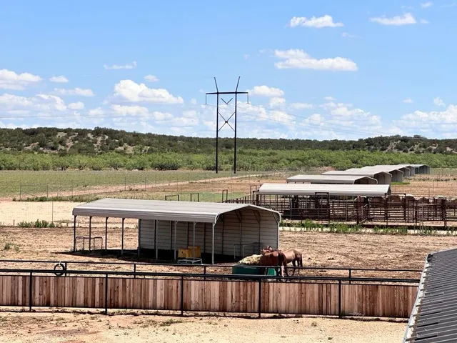 a view of a house with a yard porch and sitting area