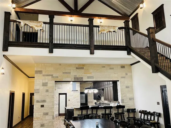 a kitchen with a table and chairs