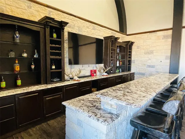 a kitchen with a stove and a sink