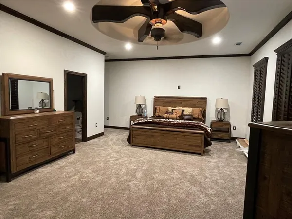 a view of an empty room with windows