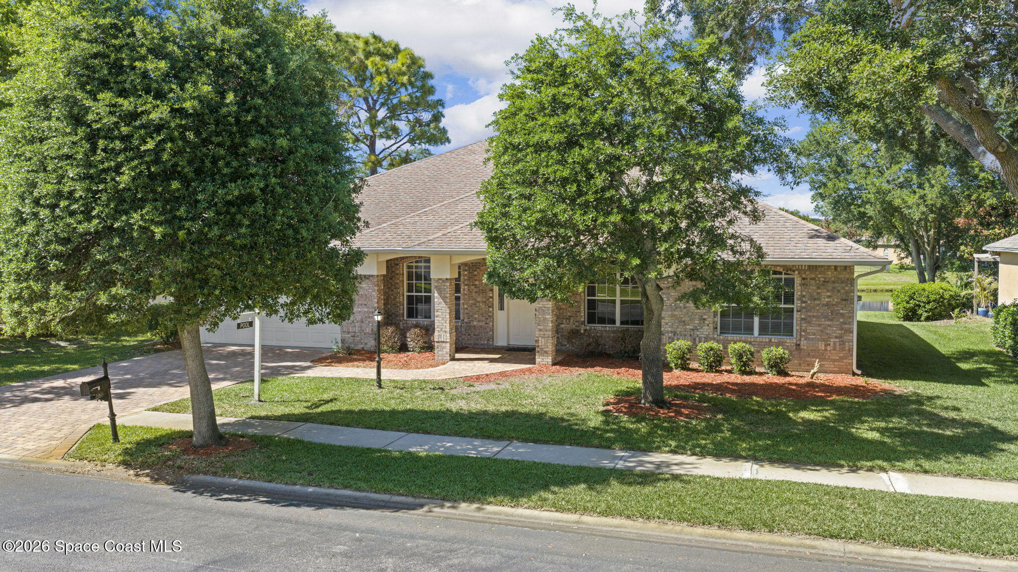 1123 Spring Oak Drive Melbourne, FL 32901 - Photo 6 of 67 a view of a house with a yard and tree s