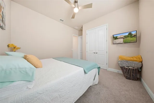 a bedroom with a bed and a couch