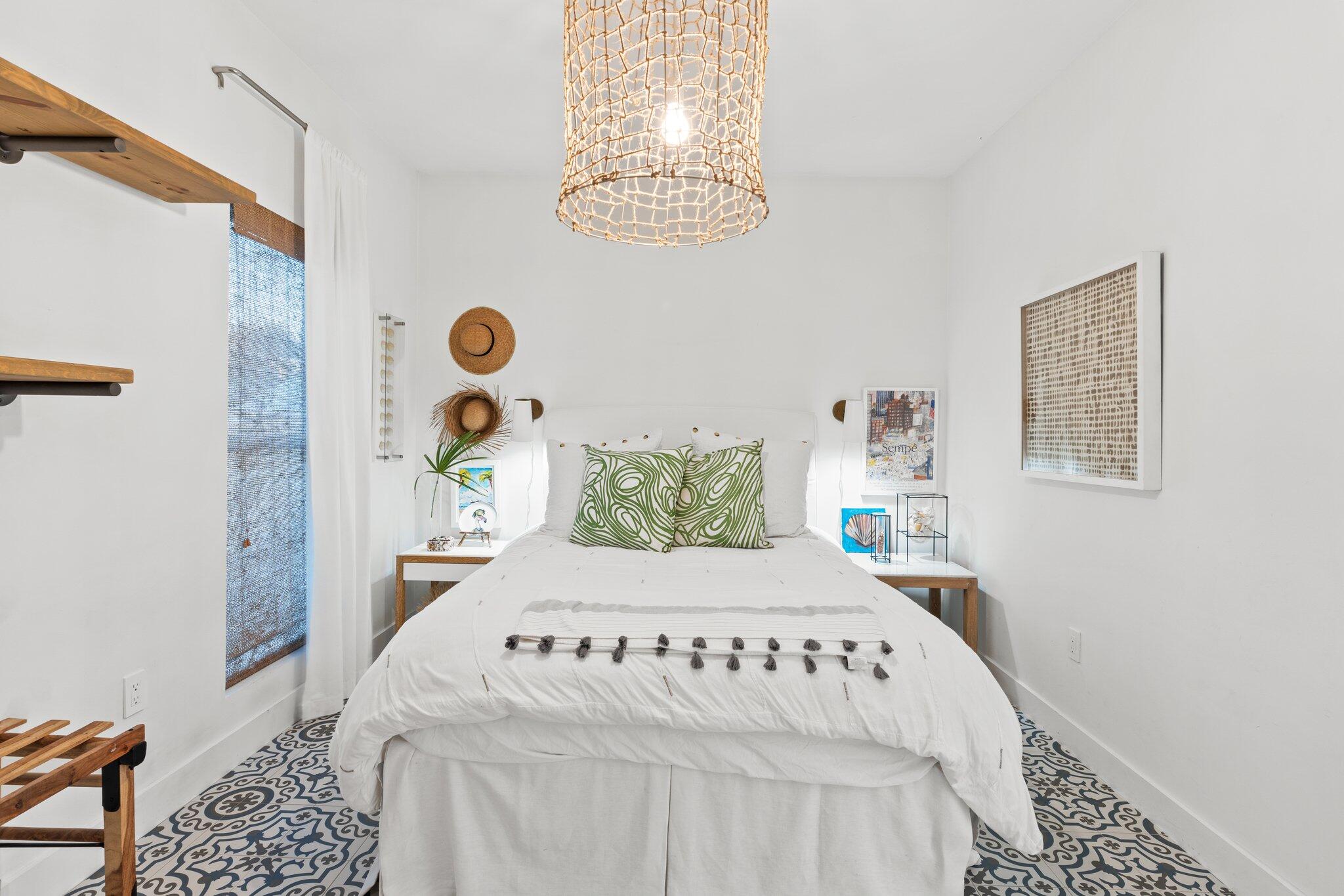 58 Cottage Way, Unit 6 Inlet Beach, FL 32461 - Photo 15 of 60 a bedroom with a bed and a chandelier