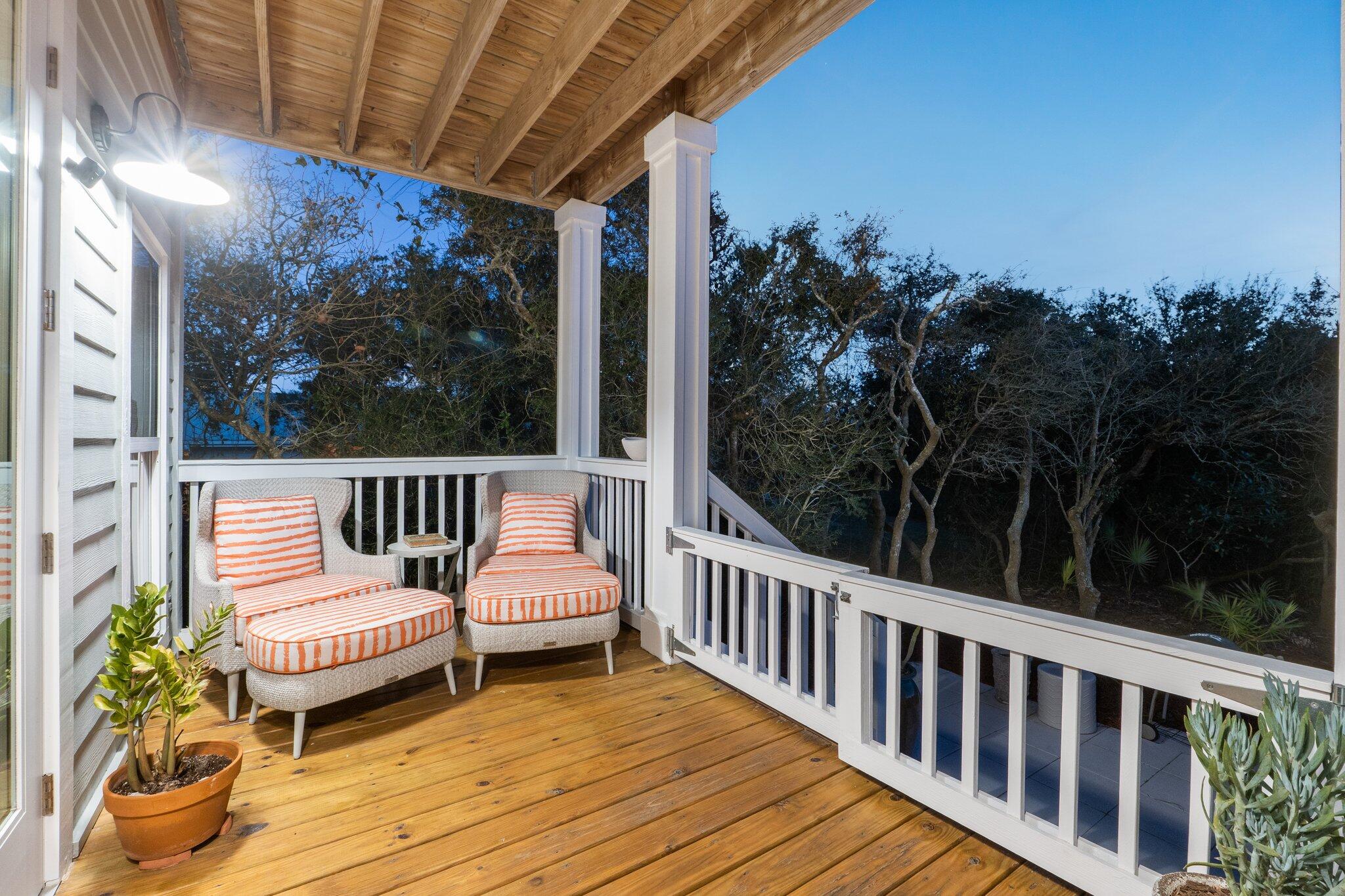58 Cottage Way, Unit 6 Inlet Beach, FL 32461 - Photo 22 of 60 a view of a chair and tables in the balcony