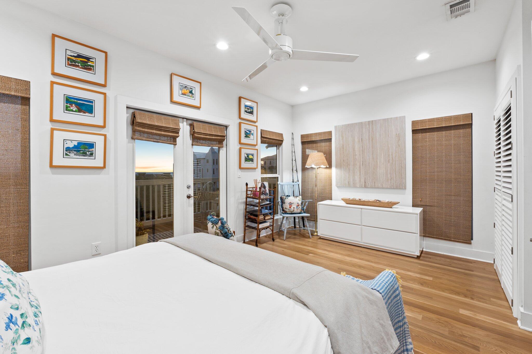 58 Cottage Way, Unit 6 Inlet Beach, FL 32461 - Photo 30 of 60 a bedroom with a large bed and a chandelier