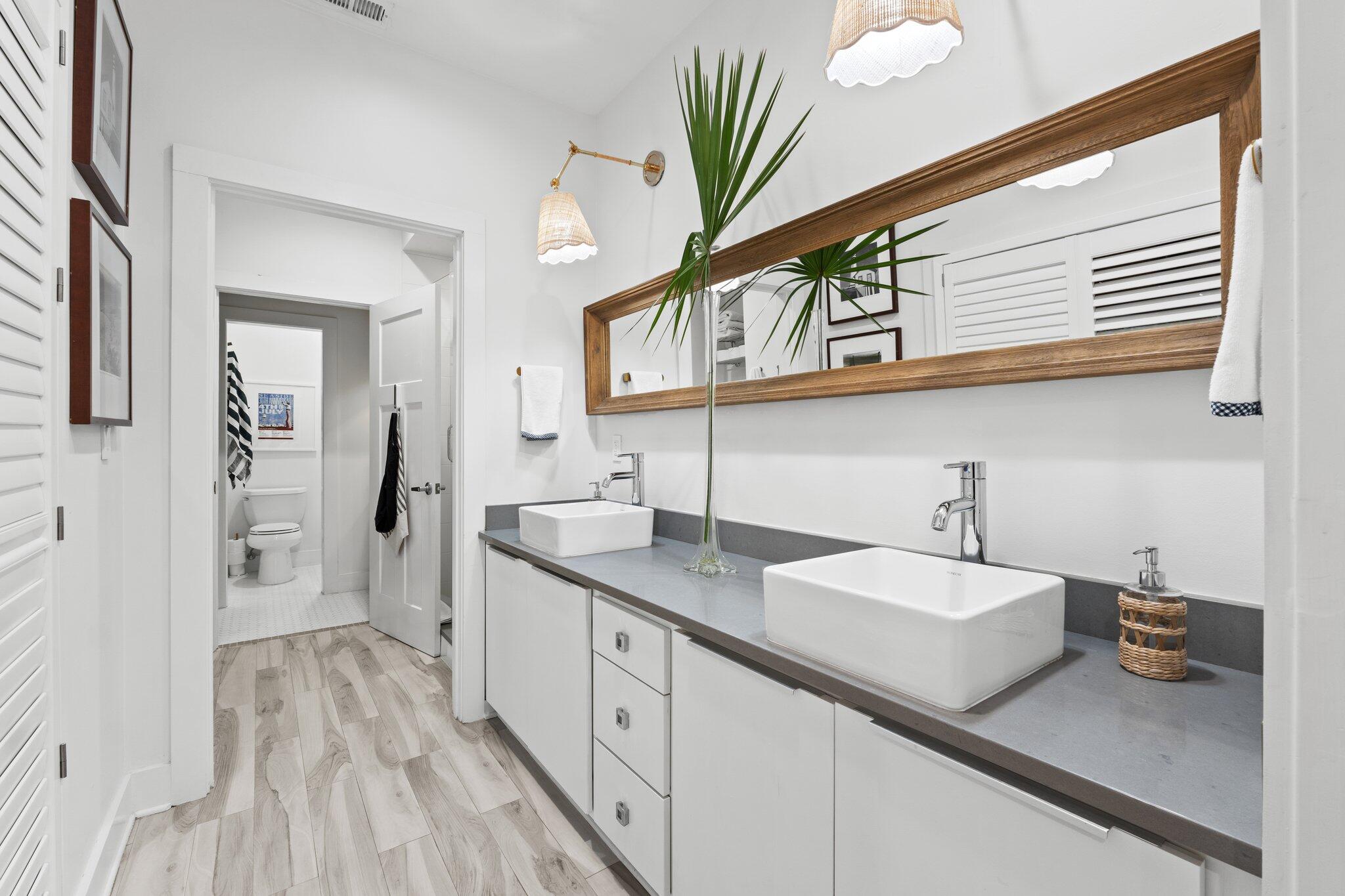 58 Cottage Way, Unit 6 Inlet Beach, FL 32461 - Photo 38 of 60 a spacious bathroom with a sink and a mirror