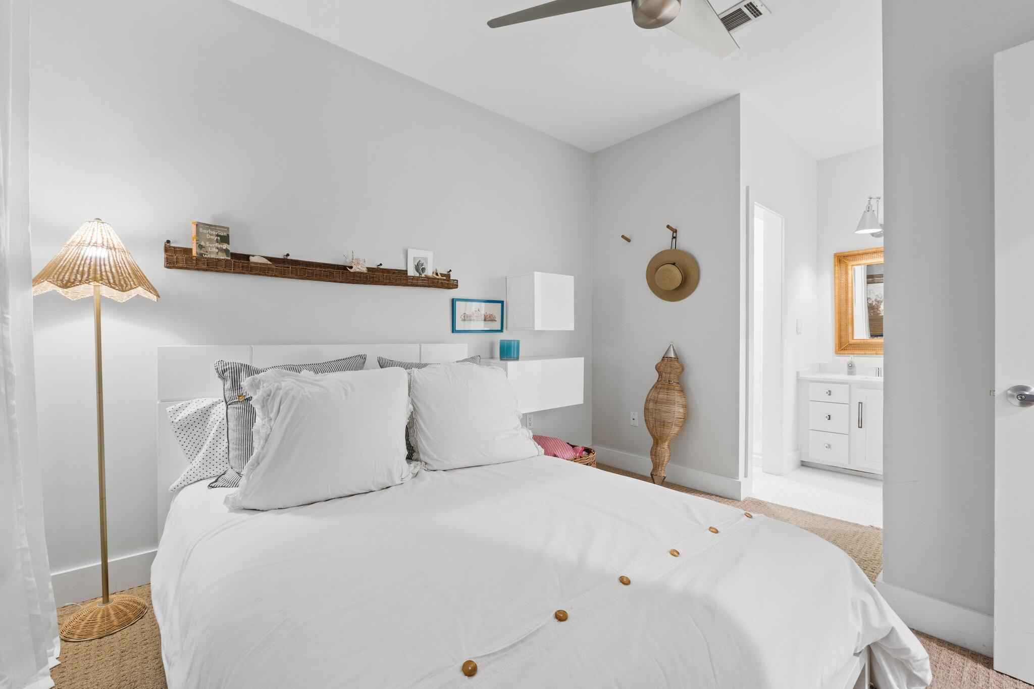 58 Cottage Way, Unit 6 Inlet Beach, FL 32461 - Photo 45 of 60 a bedroom with a bed and a lamp