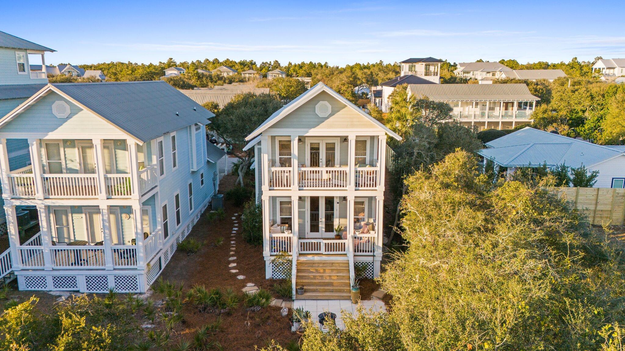 58 Cottage Way, Unit 6 Inlet Beach, FL 32461 - Photo 52 of 60 a view of a big house with a big yard and large trees