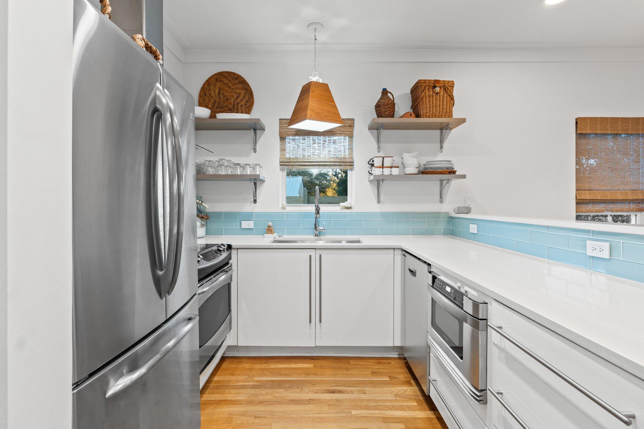 58 Cottage Way, Unit 6 Inlet Beach, FL 32461 - Photo 7 of 60 a kitchen with stainless steel appliances granite countertop a refrigerator and a sink