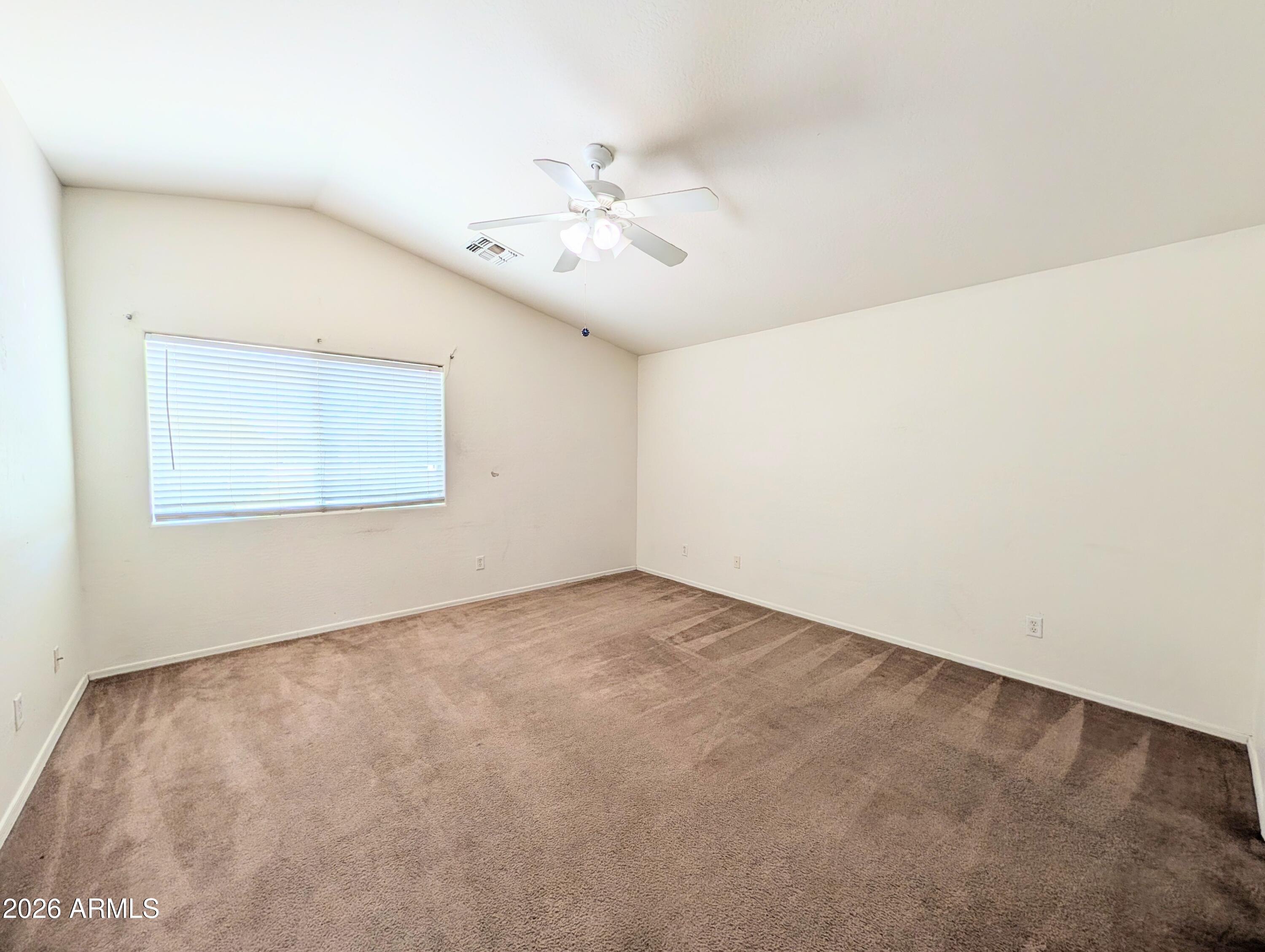 712 Baldwin Loop Coolidge, AZ 85128 - Photo 12 of 21 an empty room with a window