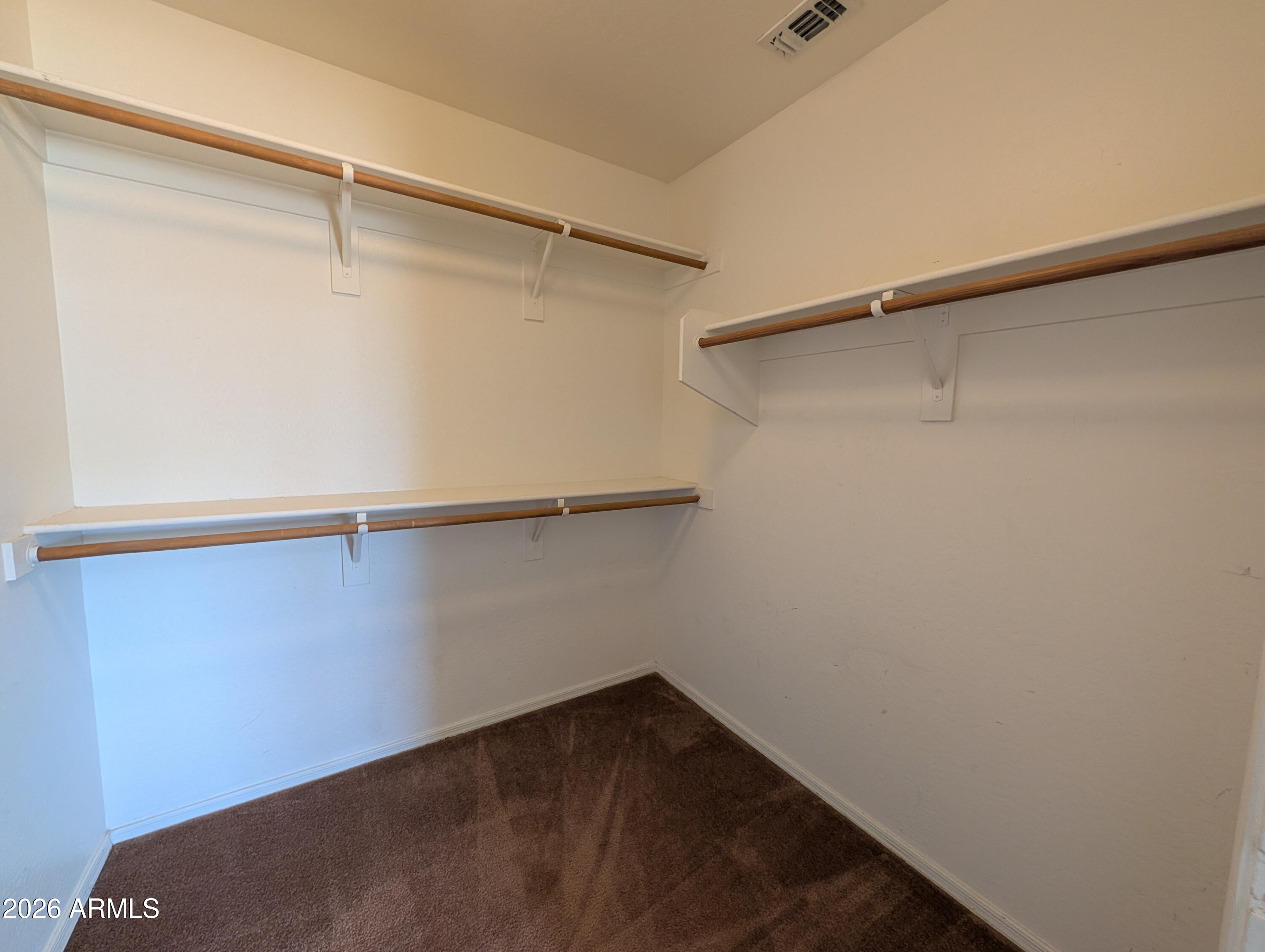 712 Baldwin Loop Coolidge, AZ 85128 - Photo 14 of 21 a view of a room with shelf on the wall
