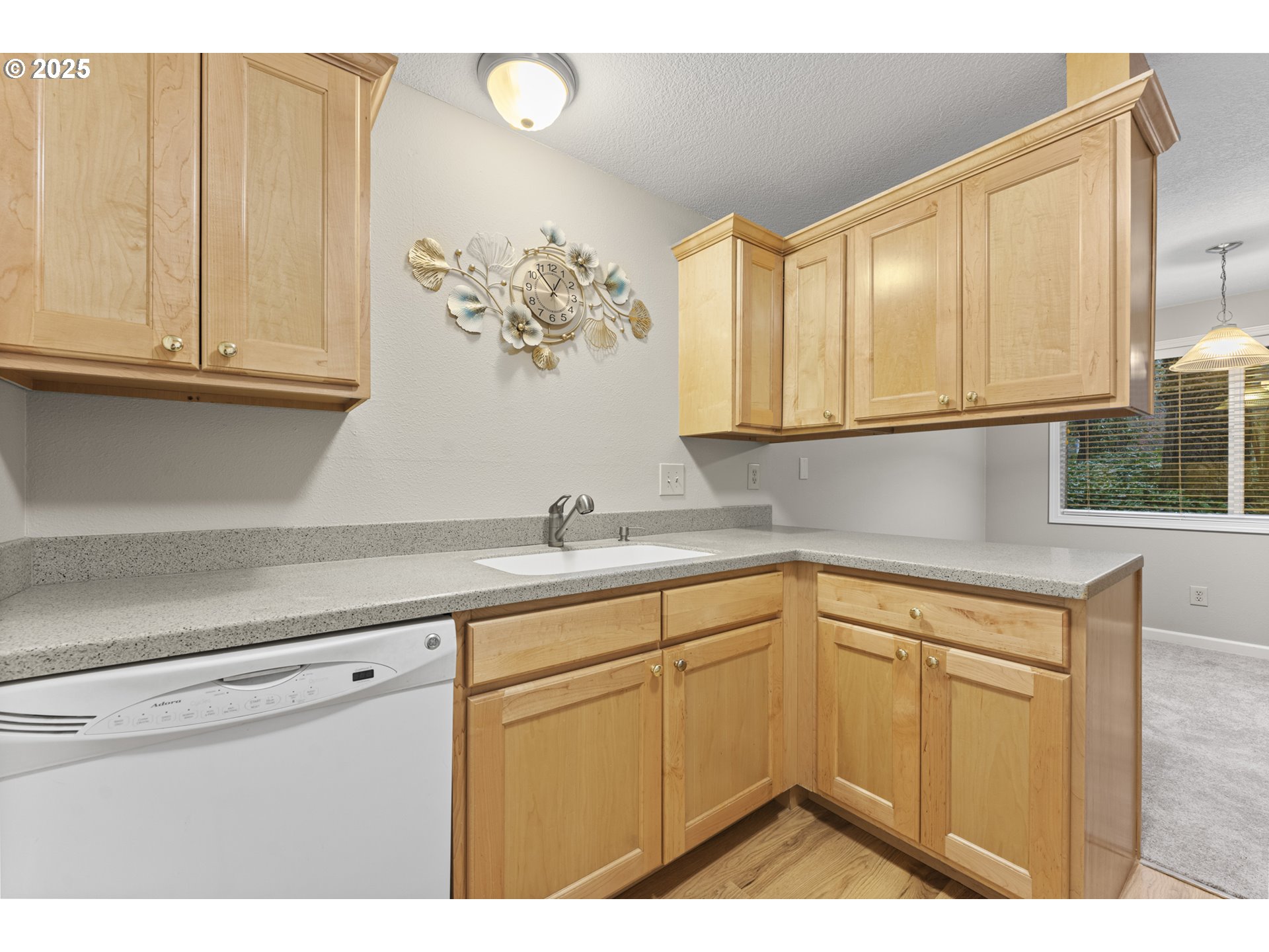 7112 Southwest Murray Boulevard Beaverton, OR 97008 - Photo 17 of 40 a kitchen with a sink and cabinets
