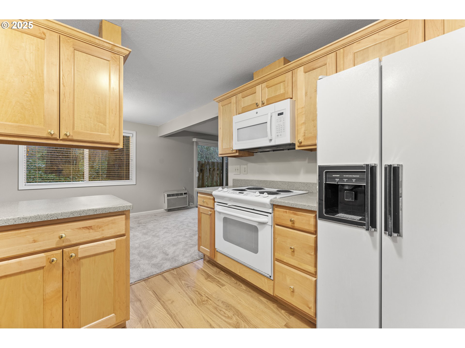 7112 Southwest Murray Boulevard Beaverton, OR 97008 - Photo 18 of 40 a kitchen with stainless steel appliances granite countertop a stove a sink and a refrigerator