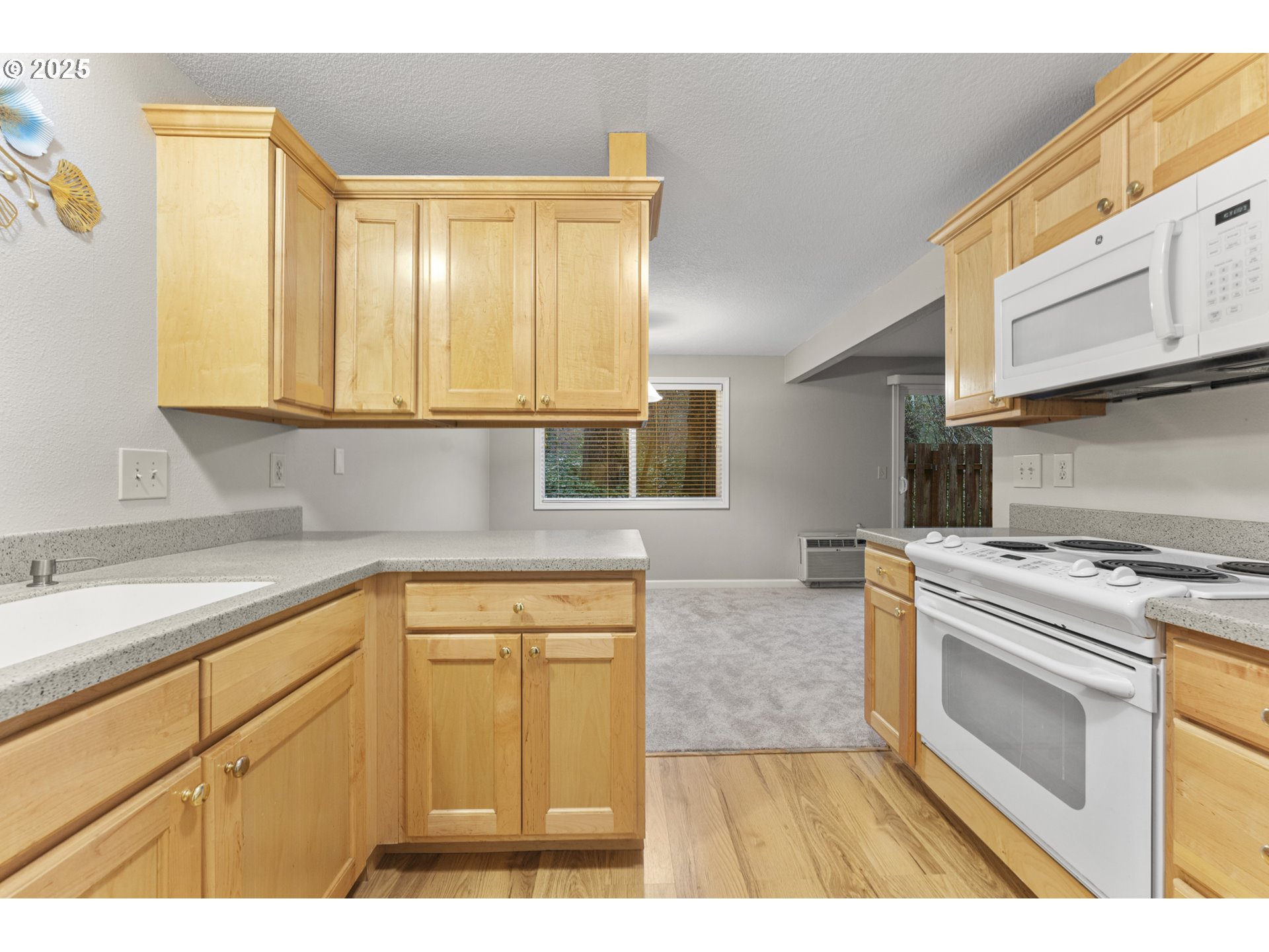 7112 Southwest Murray Boulevard Beaverton, OR 97008 - Photo 19 of 40 a kitchen with cabinets appliances and a window