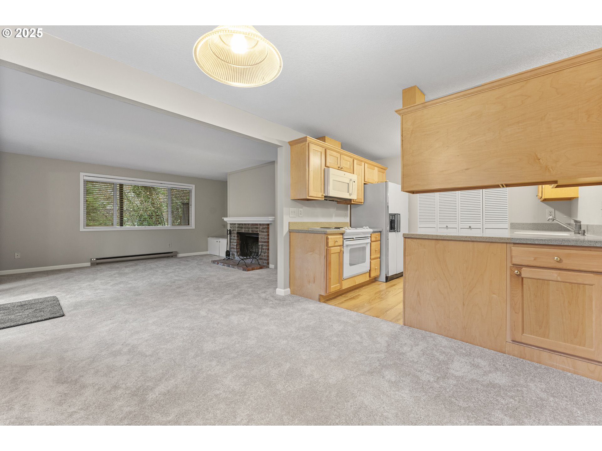 7112 Southwest Murray Boulevard Beaverton, OR 97008 - Photo 22 of 40 a view of a kitchen with furniture and a window