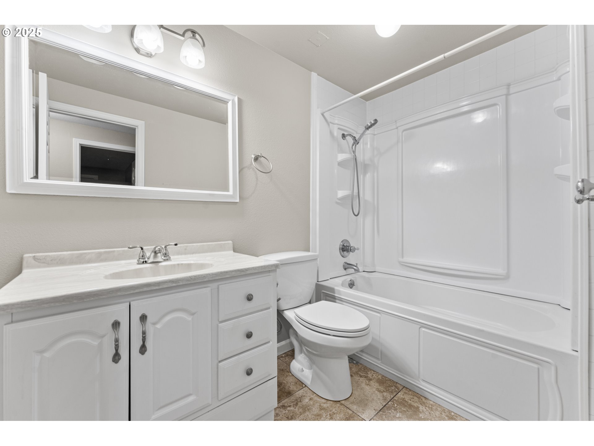 7112 Southwest Murray Boulevard Beaverton, OR 97008 - Photo 27 of 40 a bathroom with a sink toilet a mirror and shower