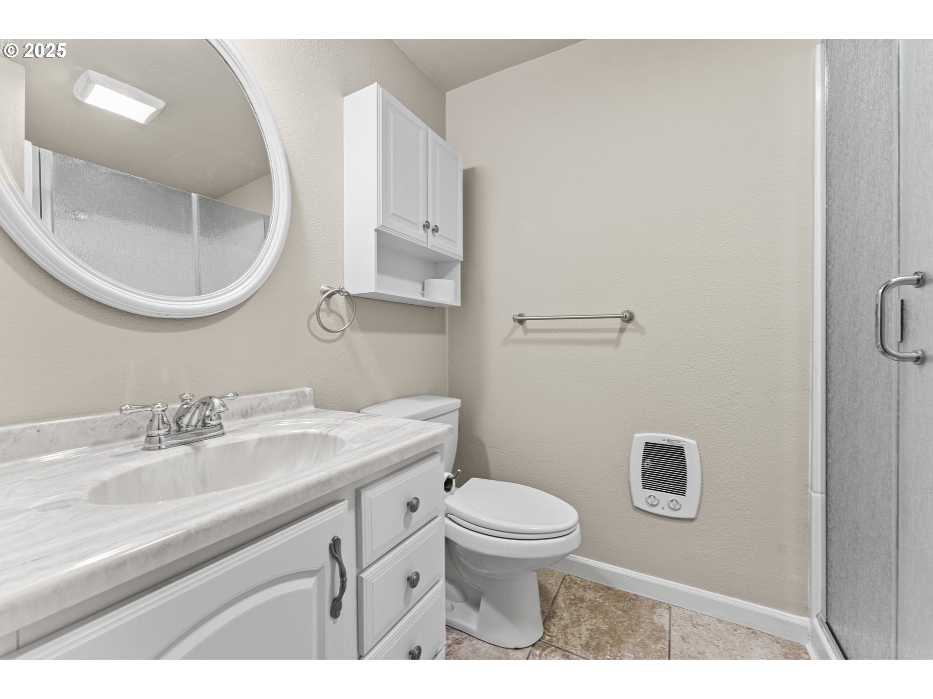 7112 Southwest Murray Boulevard Beaverton, OR 97008 - Photo 28 of 40 a bathroom with a sink a toilet and a mirror