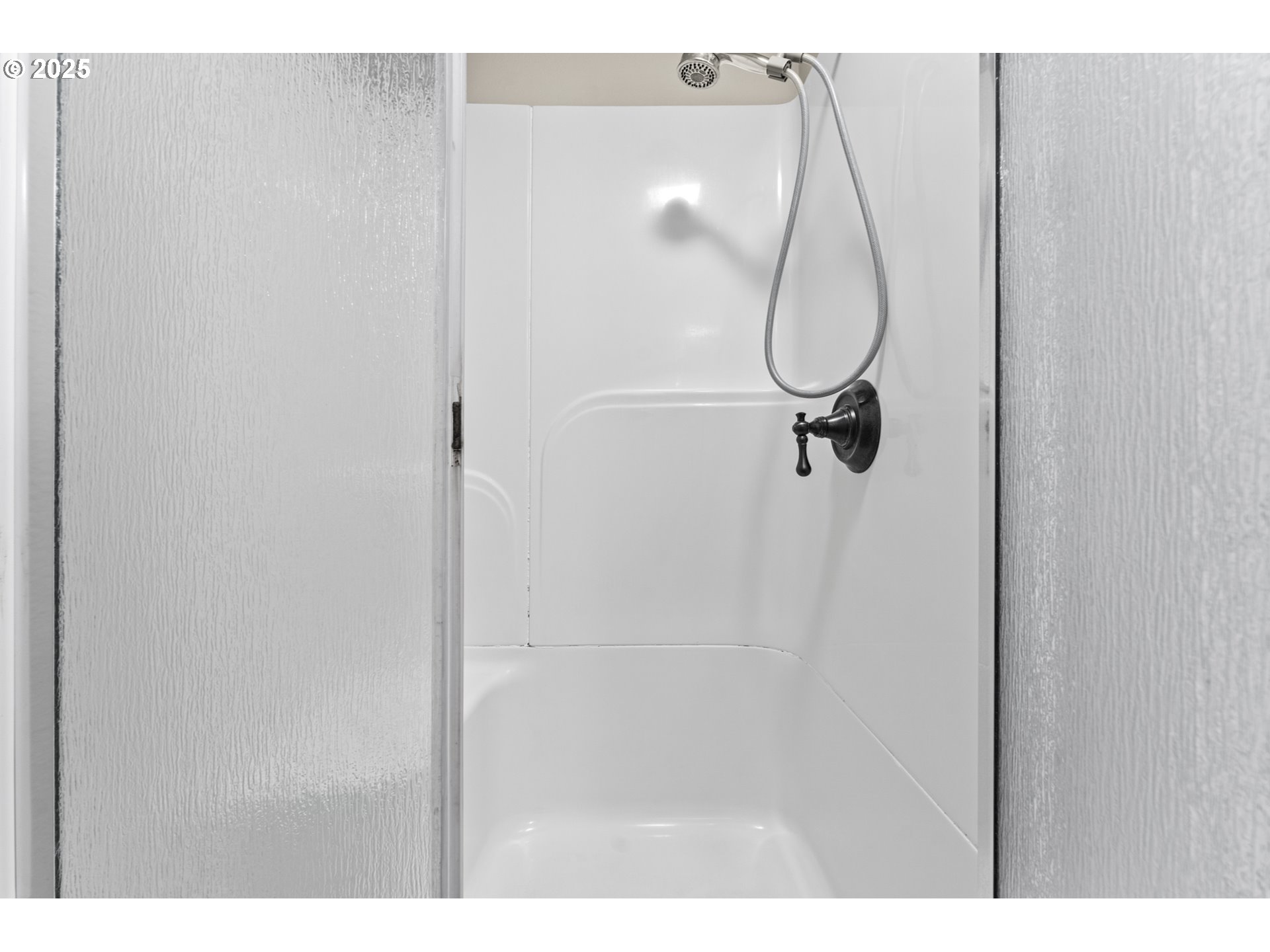 7112 Southwest Murray Boulevard Beaverton, OR 97008 - Photo 29 of 40 a bathroom with a glass shower door