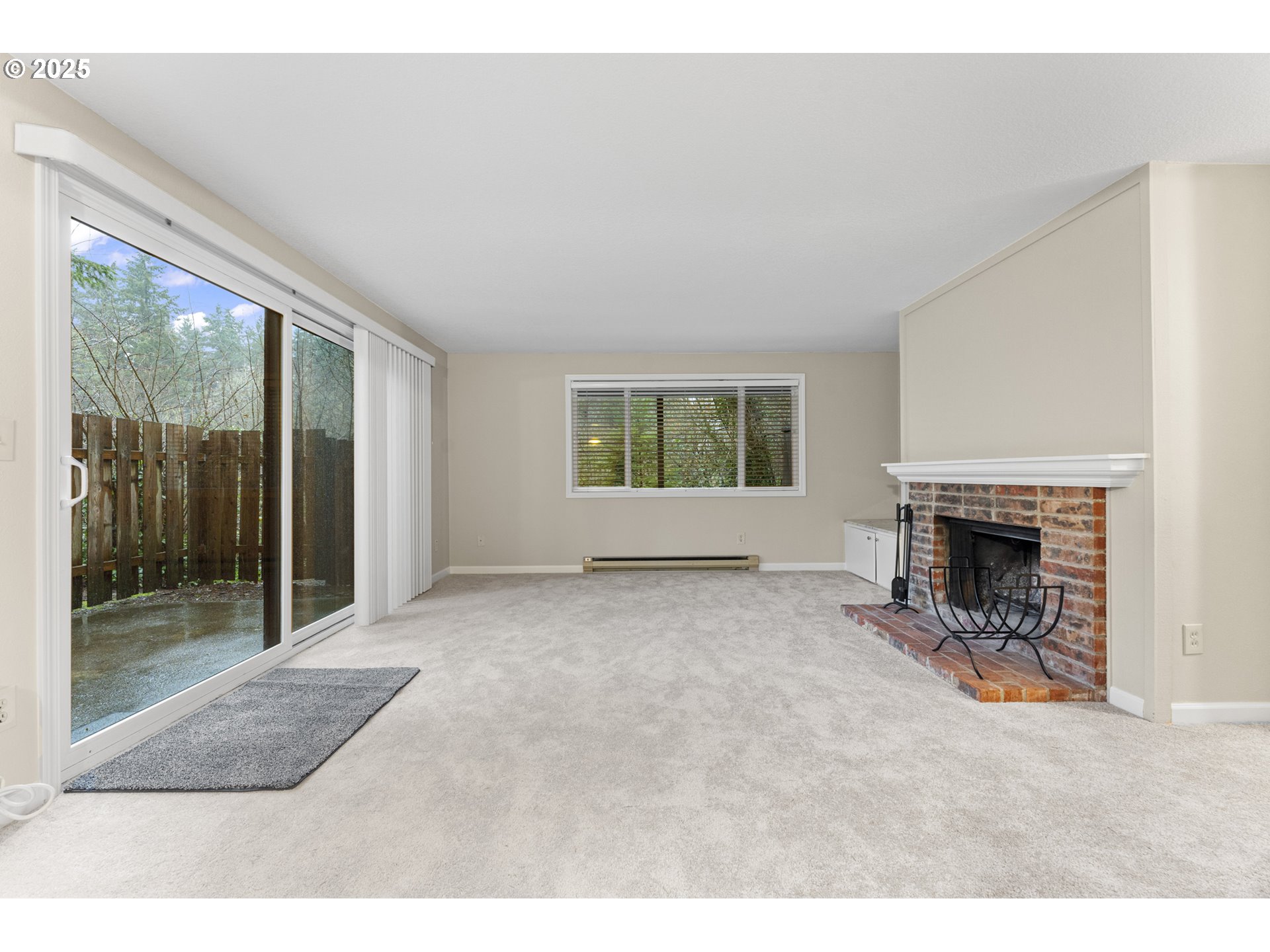 7112 Southwest Murray Boulevard Beaverton, OR 97008 - Photo 6 of 40 a view of a room with furniture and a fireplace