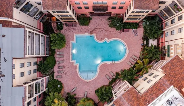 an aerial view of a swimming pool and outdoor space