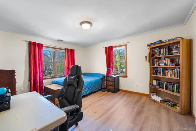 a workspace with furniture and a book shelf