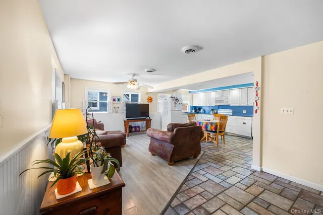 a living room with furniture and a table