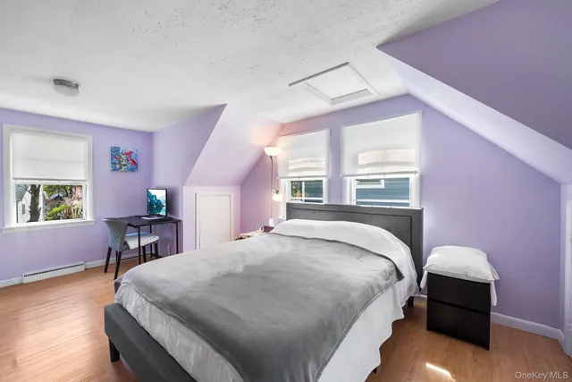 a bed room with a bed and a chair