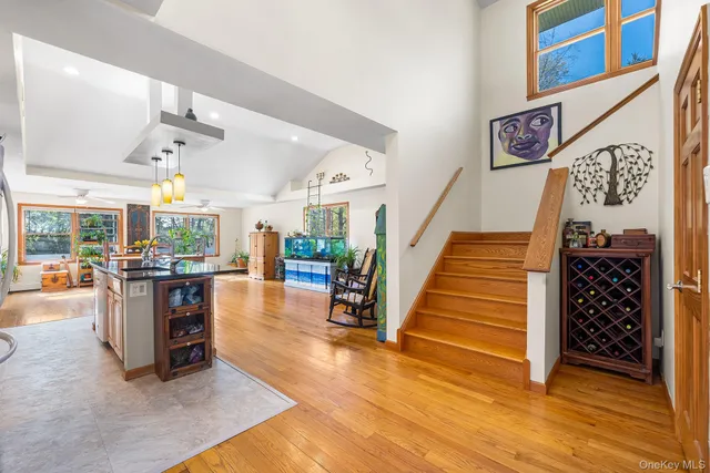 a view of entryway and hall with wooden floor