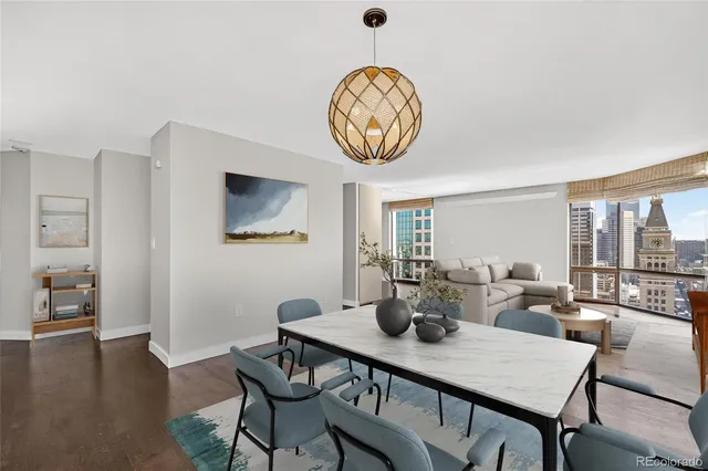 a view of a dining room with furniture window and wooden floor