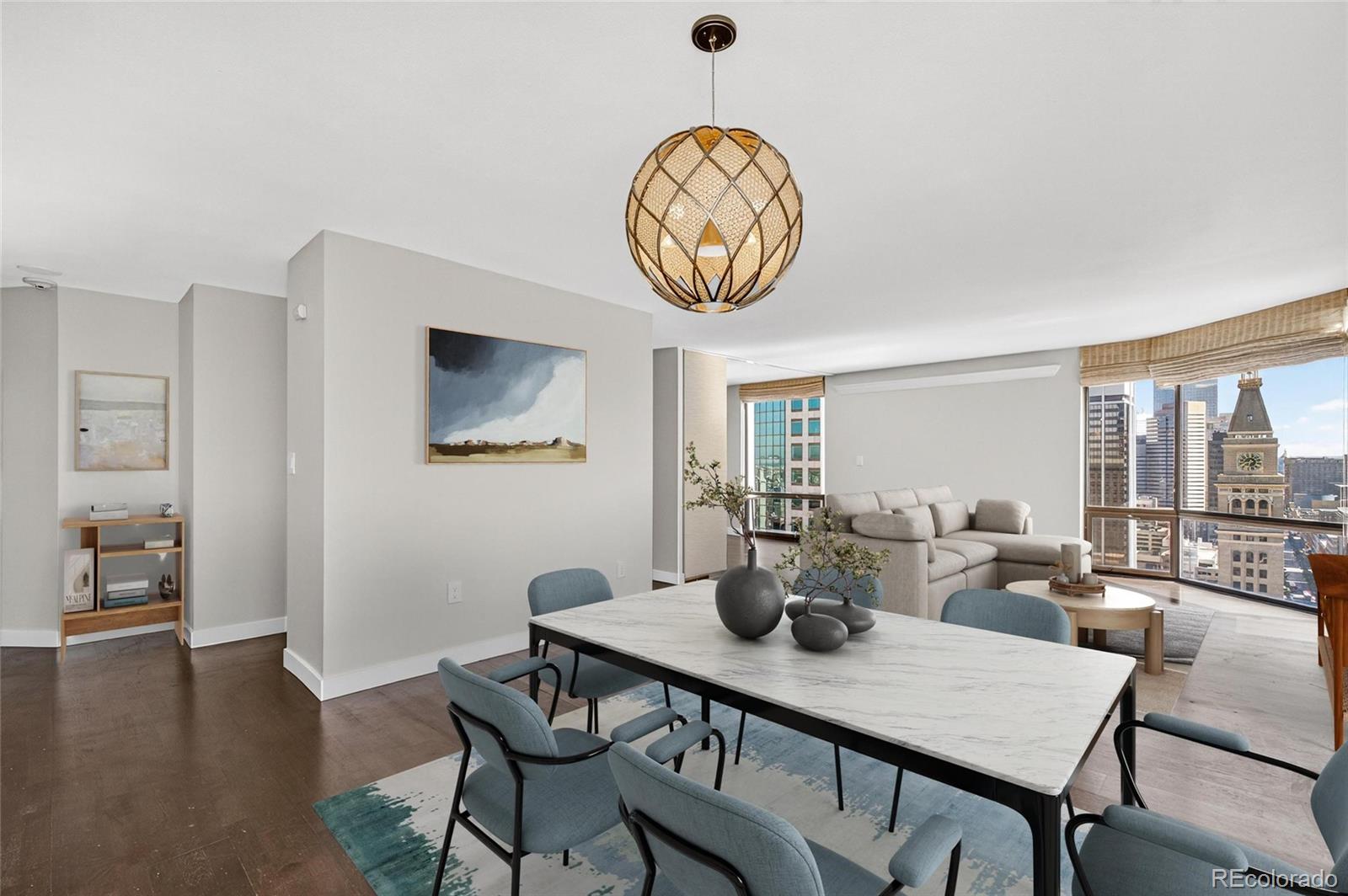 a view of a dining room with furniture window and wooden floor