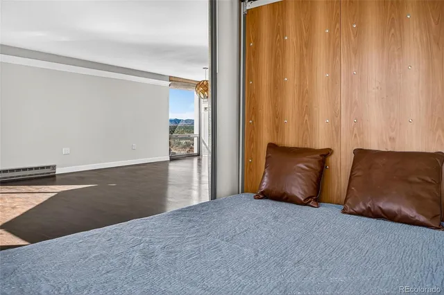 a living room with a bed and furniture