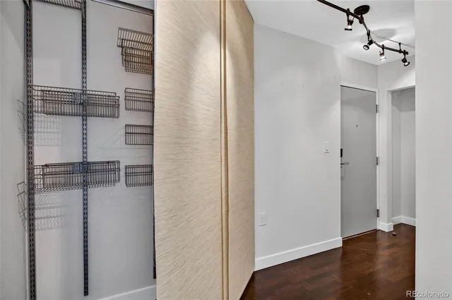 a view of a room with wooden floor