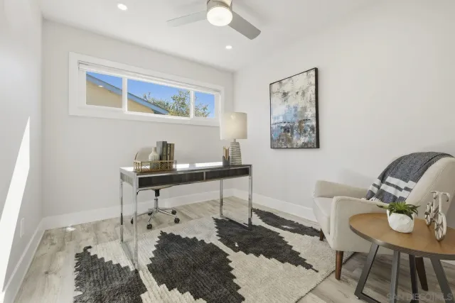 a living room with furniture and a rug