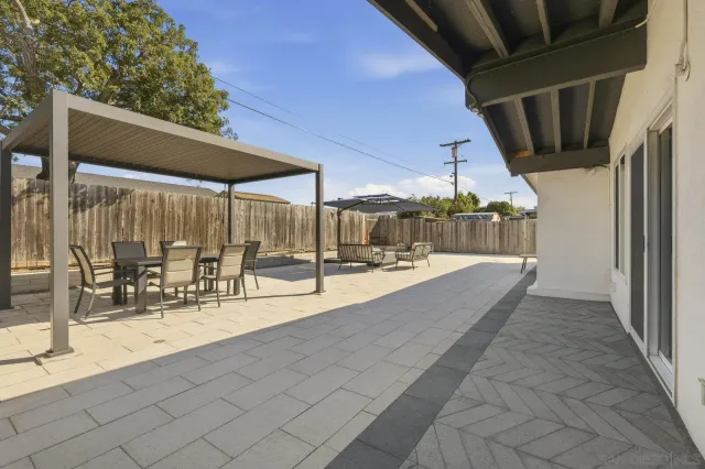 a view of swimming pool with outdoor seating