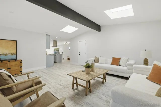 a living room with furniture and a table