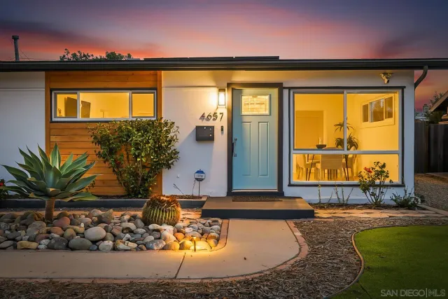 a view of swimming pool with a lounge chairs