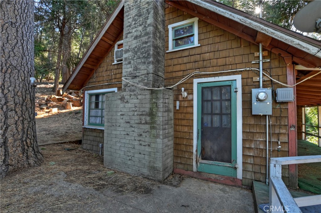 a view of a brick house with large windows
