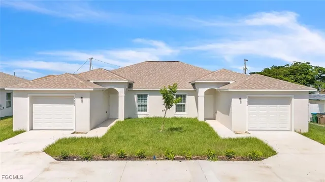 front view of a house with a yard