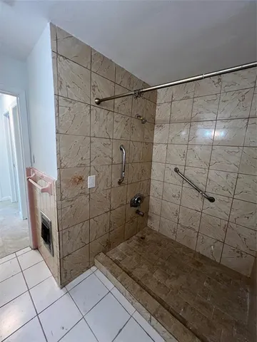 an empty room with a empty space and windows