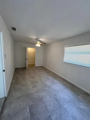 a kitchen with stainless steel appliances a sink stove and cabinets